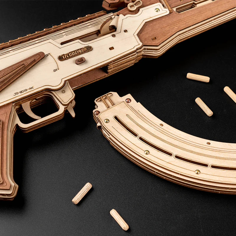 Wooden Lumigic AK47 assault rifle toy model assembled as a 3D puzzle, showcasing detailed wooden construction and realistic firearm shape.