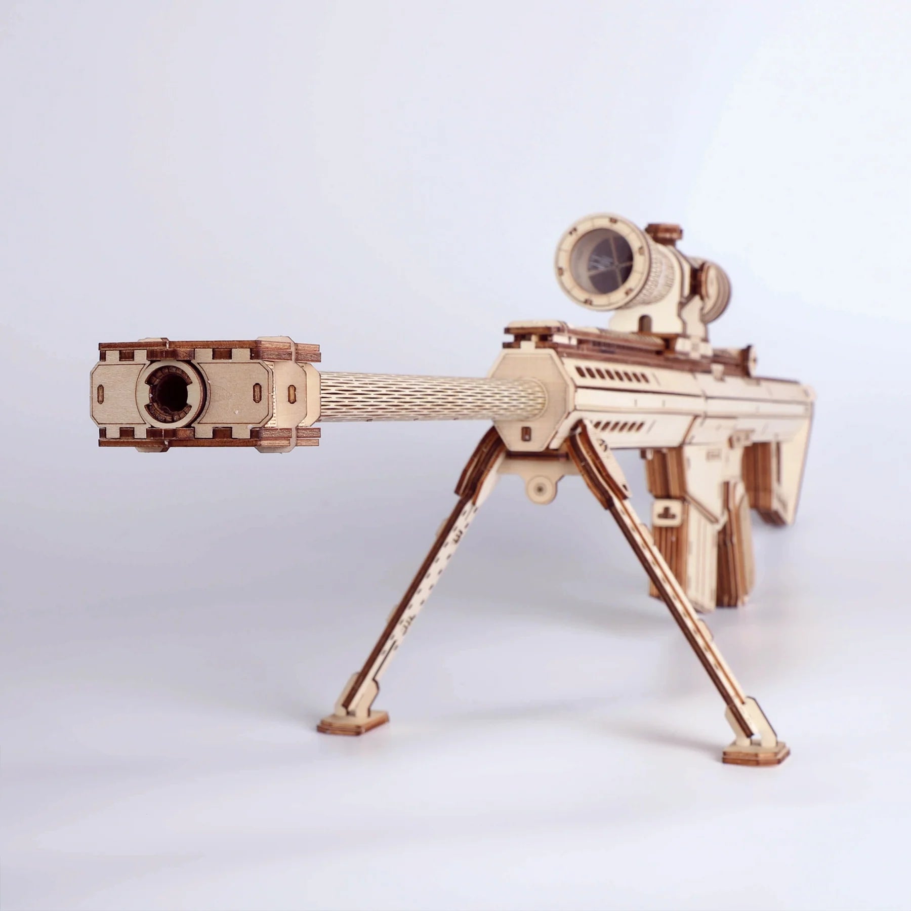 Lumigic Barrett M82A1 sniper rifle wooden 3D puzzle model kit showing assembled detailed gun with intricate wooden parts.