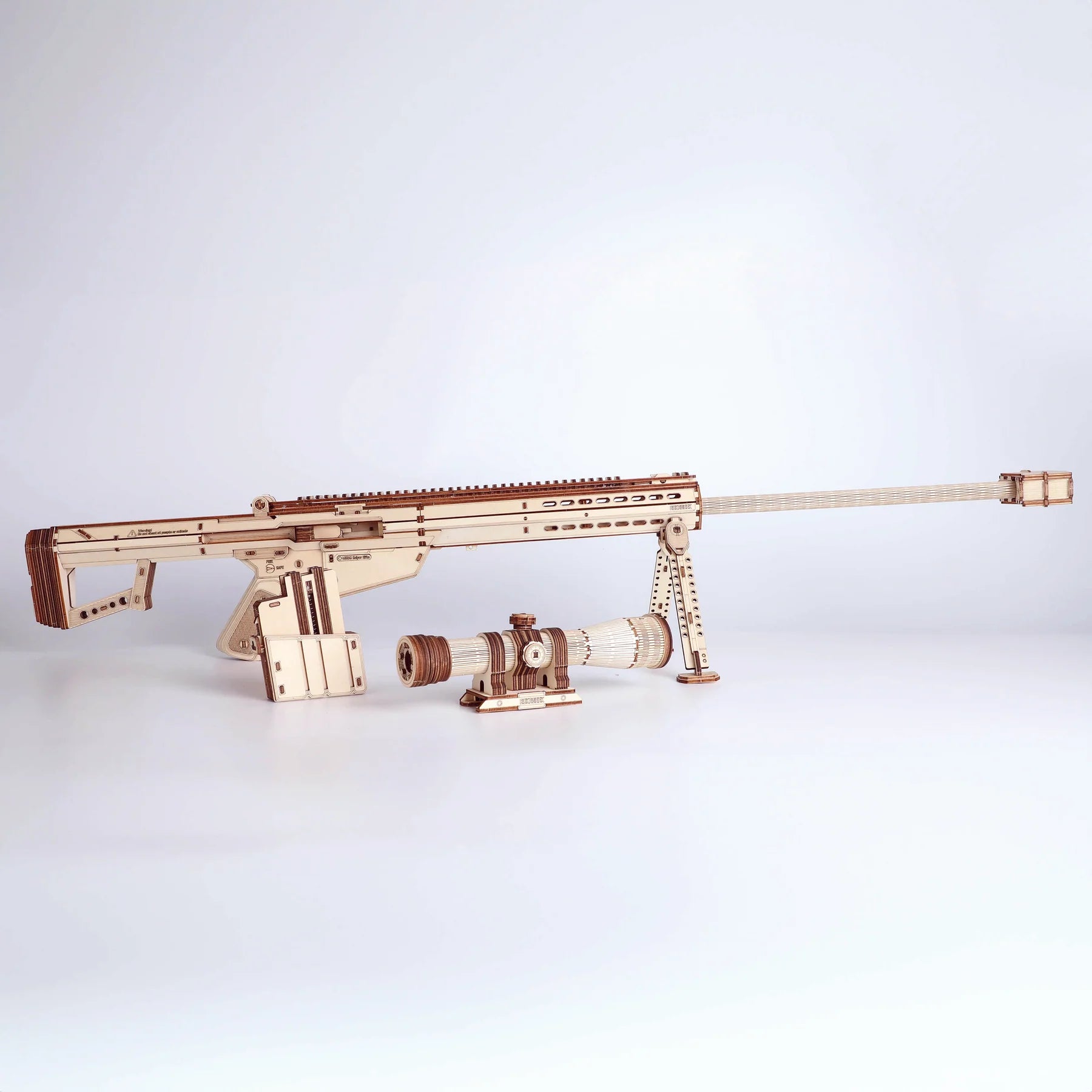 Wooden Barrett M82A1 sniper rifle toy model kit by Lumigic, assembled 3D puzzle featuring detailed parts and realistic design.