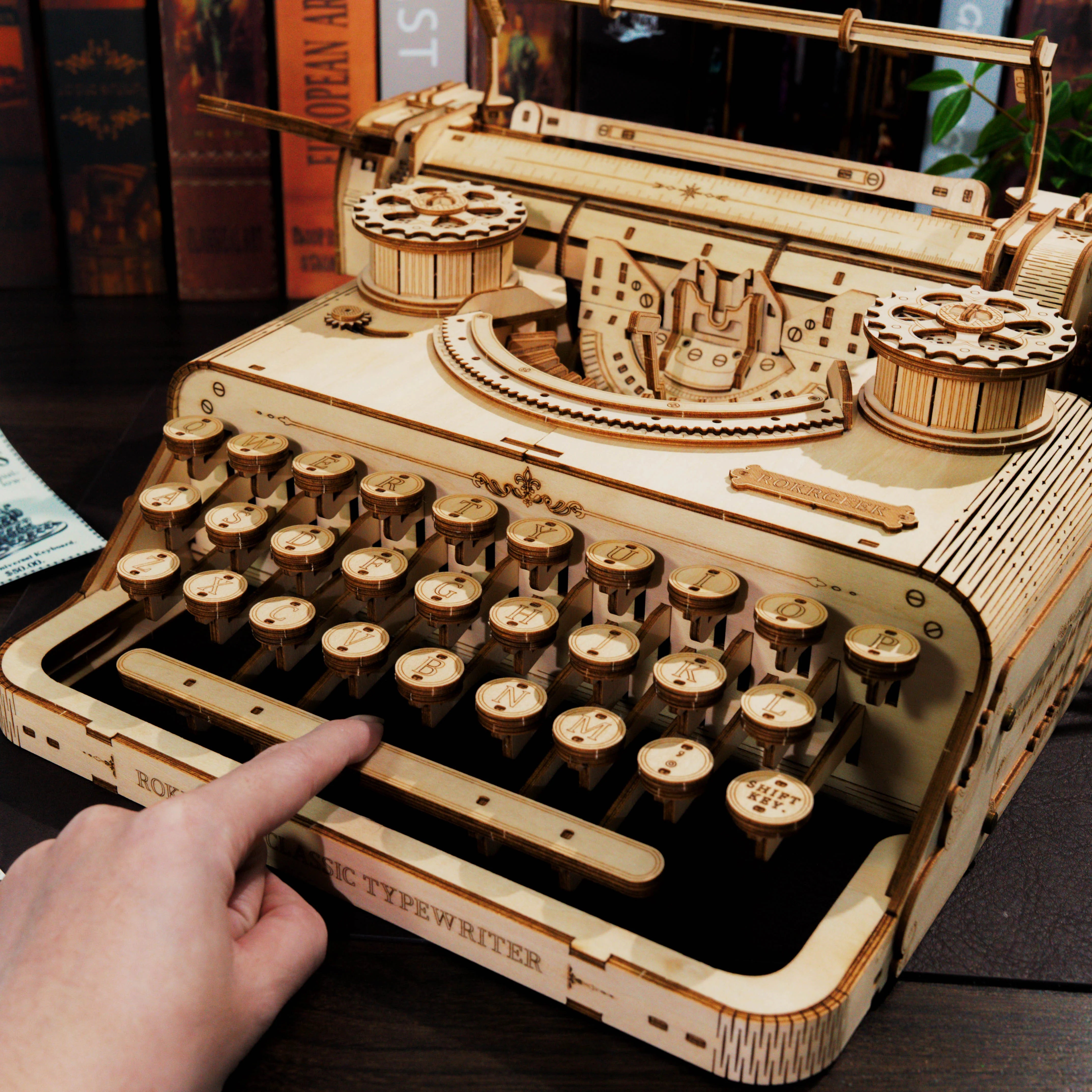 Lumigic Classic Typewriter Mechanical 3D Wooden Puzzle showing detailed wooden pieces assembled into a vintage typewriter design.