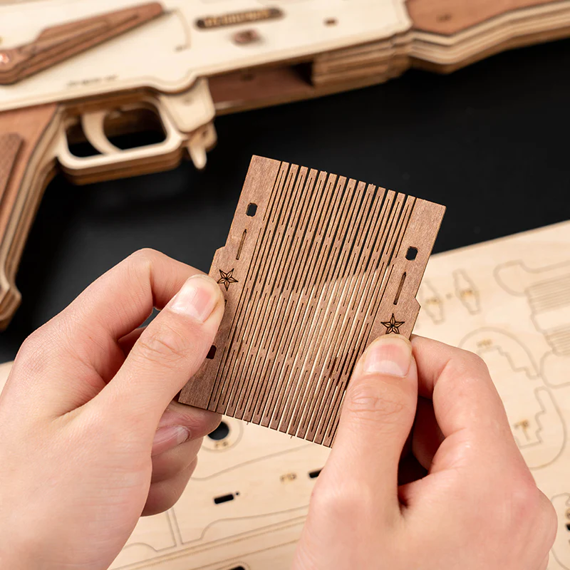 Wooden Lumigic AK47 assault rifle 3D puzzle model, showcasing detailed craftsmanship and realistic design.