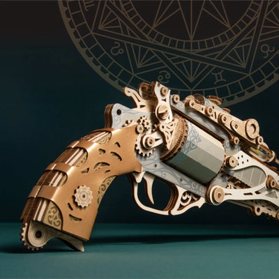 Blue wooden steam revolver gun model puzzle by howcat, featuring intricate 3D design and detailed craftsmanship.
