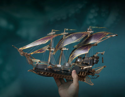Wooden pirate ship 3D puzzle model by howcat, detailed multi-piece wooden ship with sails and rigging for assembly.